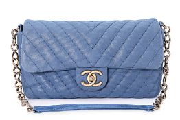 A CHANEL BLUE CHEVRON QUILTED FLAP BAG