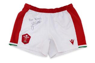 A PAIR OF SIGNED GEORGE NORTH, MATCH WORN SHORTS