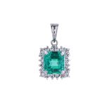 AN EMERALD AND DIAMOND CLUSTER PENDANT