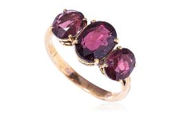 A GARNET THREE STONE RING