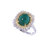 AN EMERALD CABOCHON AND DIAMOND RING