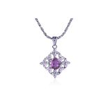 A PINK SAPPHIRE AND DIAMOND PENDANT ON A CHAIN
