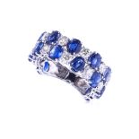 A SAPPHIRE AND DIAMOND RING