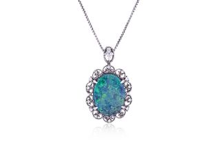 A BLACK OPAL AND DIAMOND PENDANT ON CHAIN