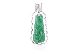 A CARVED JADE PENDANT WITH DETACHABLE FRAME
