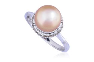 A CULTURED SOUTH SEA PEARL AND DIAMOND RING