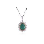 AN EMERALD AND DIAMOND PENDANT ON CHAIN