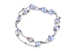 A CULTURED BAROQUE PEARL NECKLACE WITH SAPPHIRE SPACINGS