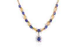 A BLUE AND WHITE SAPPHIRE GOLD NECKLACE