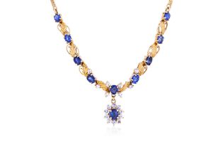 A BLUE AND WHITE SAPPHIRE GOLD NECKLACE