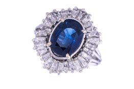 A SAPPHIRE AND DIAMOND CLUSTER RING