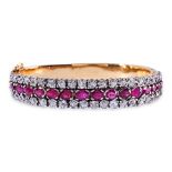 A THREE ROW RUBY AND DIAMOND BANGLE