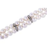 A CULTURED PEARL DOUBLE STRAND BRACELET WITH DIAMOND SPACERS