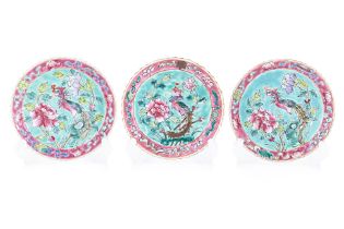 A GROUP OF THREE TURQUOISE GROUND FAMILLE ROSE SAUCERS