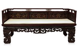 A CARVED AND PARCEL GILT WOOD BENCH