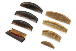 A GROUP OF EIGHT ASSORTED COMBS