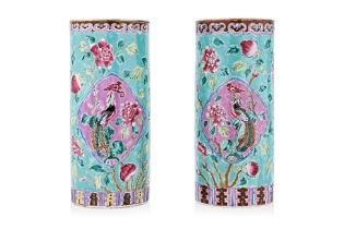 A PAIR OF GREEN GROUND FAMILLE ROSE JOSS STICK HOLDERS