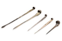 A GROUP OF FIVE SILVER HAIRPINS