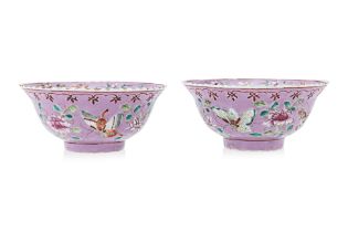 A PAIR OF PINK GROUND FAMILLE ROSE 'BUTTERFLY' BOWLS