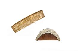 A GILT METAL COMB AND A WHITE METAL MOUNTED COMB