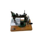 Vintage Miniature Grain Sewing Machine - 22.5cm long and 21cm tall.