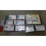 A box of Royal Mail First Day Covers in four albums and a part album of postal history