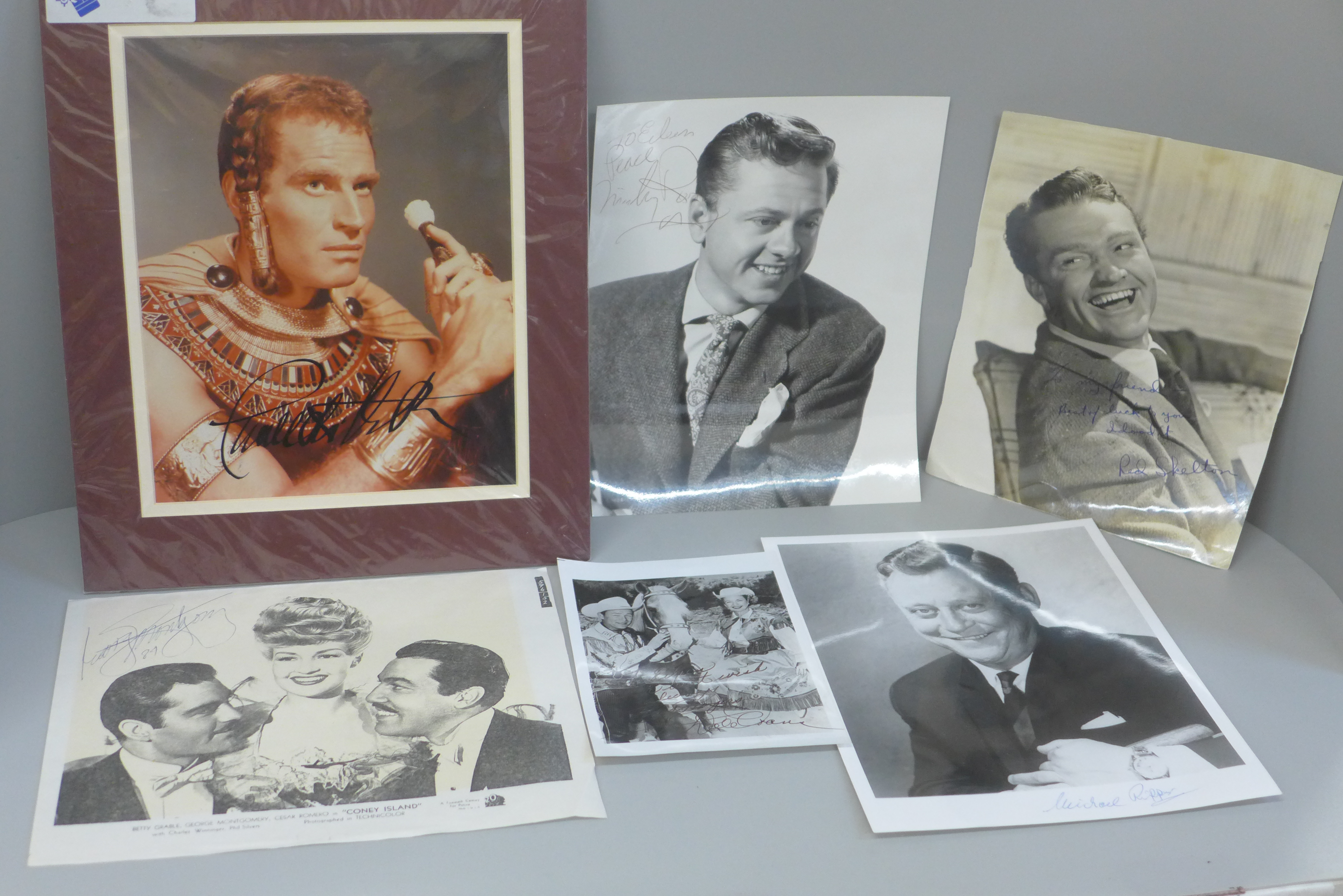 Signed photographs of Mickey Rooney, Red Skelton, Charlton Heston, etc., (6)