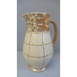 A Charlotte Rhead Bursley Ware trellis pattern jug, 24.5cm