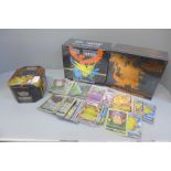 Two Pokemon trading card games, boxed, and other Pokemon cards in tin