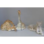 Two USSR made model giraffe and a Royal Copenhagen lioness