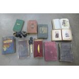 A collection of books, a pair of military binoculars marked Kershaw 1943, a lighter, etc.