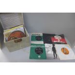 Thirty vinyl 7" singles, in vintage case, Rock, Pop and Reggae including The Beatles, Bowie, The