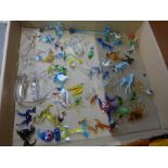 A collection of glass animal figures, approximately fifty in total