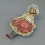 An early 20th Century ‘cheeky’ trinket dish, length 20cm, some small chips