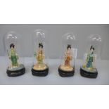Four small oriental Four Seasons figures under glass domes, 9cm