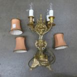 An Ormolu four arm table lamp with deep apricot shades **PLEASE NOTE THIS LOT IS NOT ELIGIBLE FOR