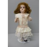 A doll, marked 1902, 12/0, 27cm