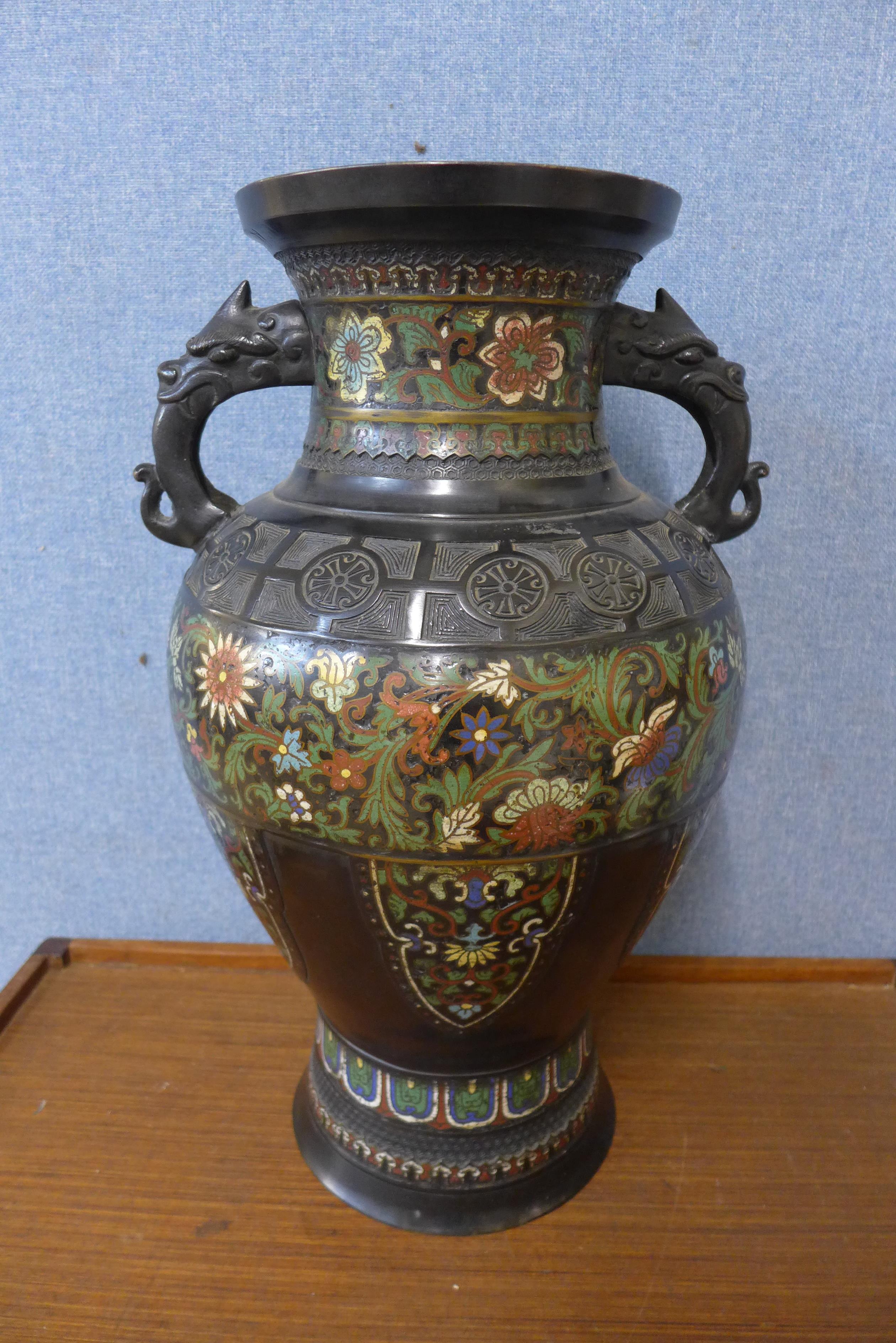 A Champleve enamelled bronze double handled vase