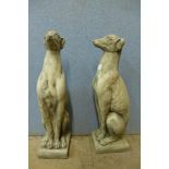 A pair of concrete figural greyhounds