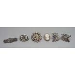 A pair of silver cufflinks, a Victorian silver brooch and three other brooches which test as silver