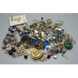 Fifty pairs of clip-on and stud earrings