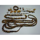 A collection of tigers eye jewellery, some set in silver