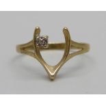 A 9ct gold diamond set wishbone ring, 1g, M