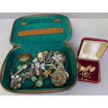 A collection of vintage jewellery including silver and a seed pearl starburst pendant