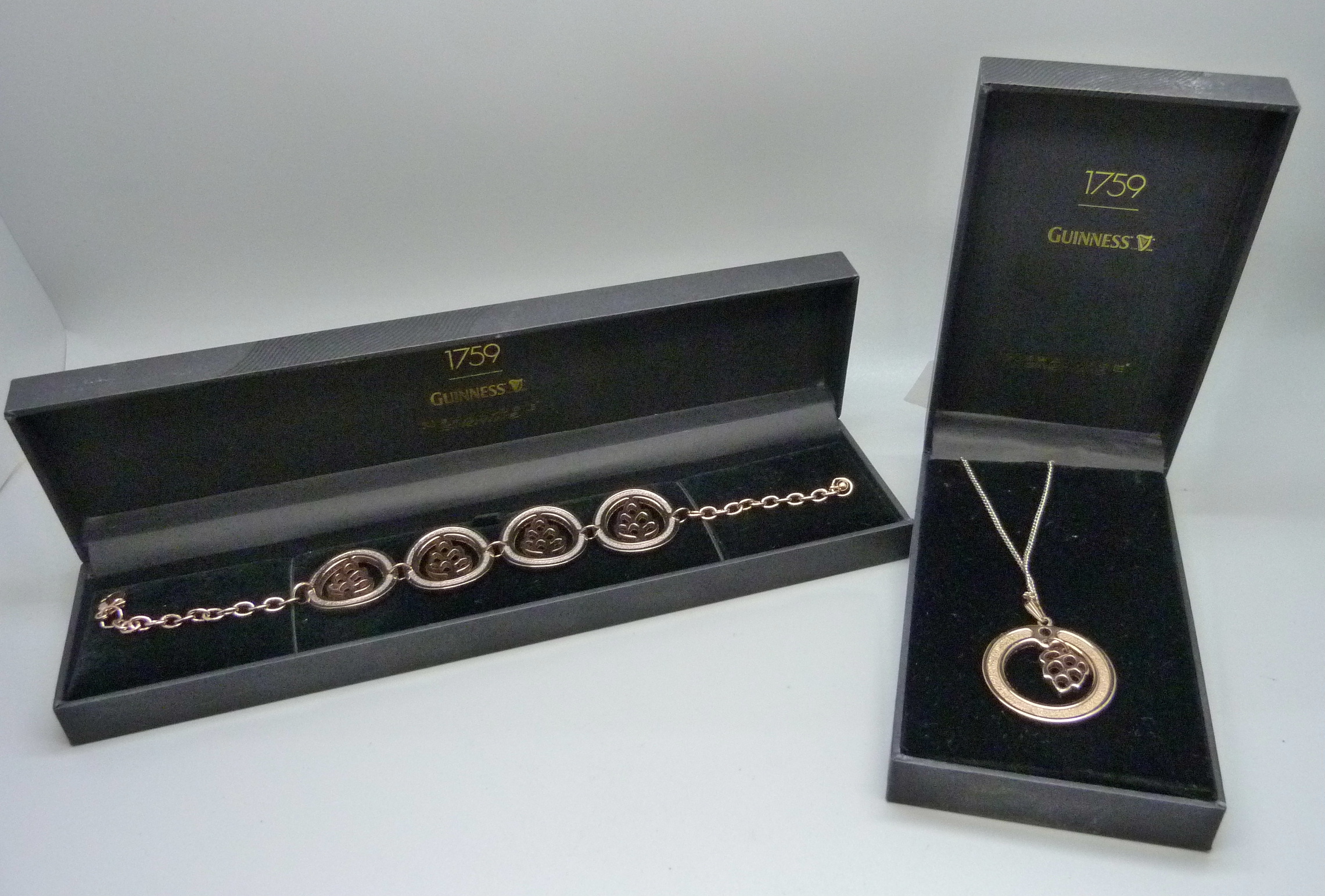 A gilt Guinness bracelet and a similar pendant and chain, boxed