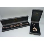 A gilt Guinness bracelet and a similar pendant and chain, boxed