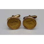 A pair of 9ct gold cufflinks each set with 1/10oz. fine gold Krugerrand coins, total weight 13.7g