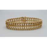 An 18ct gold bracelet, marked 750, 26.6g