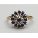 An 18ct gold, sapphire and diamond cluster ring, 4.34g, M