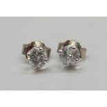 A pair of 18ct white gold and diamond stud earrings, total diamond weight, 0.70 carats